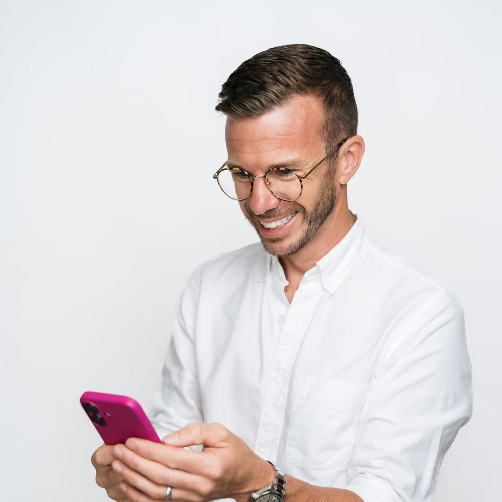 Hayden Judd smiling at his phone